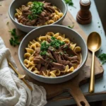 Slow cooker beef and noodles in a ceramic bowl