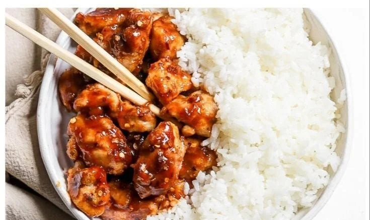 Plate of crispy Air Fryer General Tso's Chicken garnished with green onions