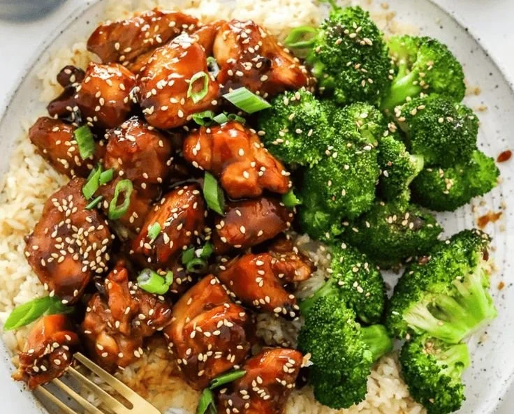 Air Fryer Teriyaki Chicken plated with sesame seeds and green onions