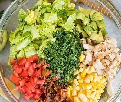 Bacon Avocado Chicken Salad with fresh ingredients and toppings