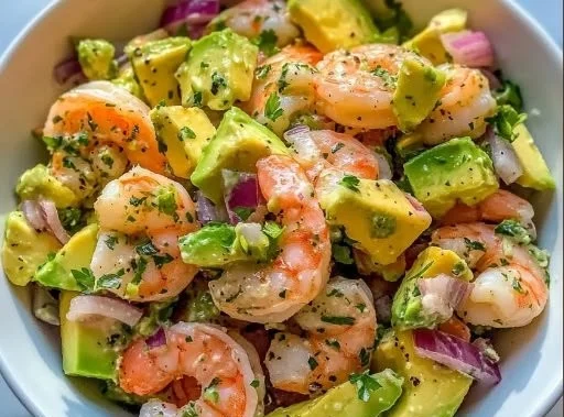 Fresh shrimp avocado salad with vibrant vegetables on a plate