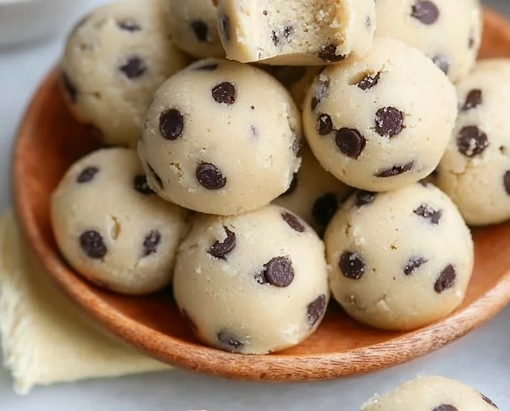 Gluten-free cottage cheese cookie dough bites on a wooden table.