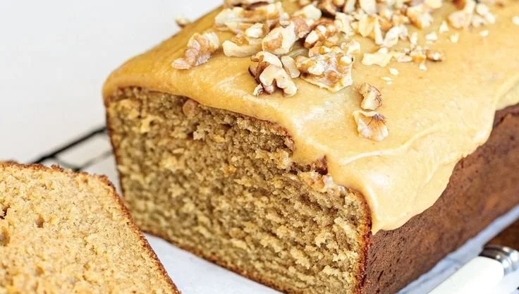 Slice of condensed milk coffee loaf cake on a plate