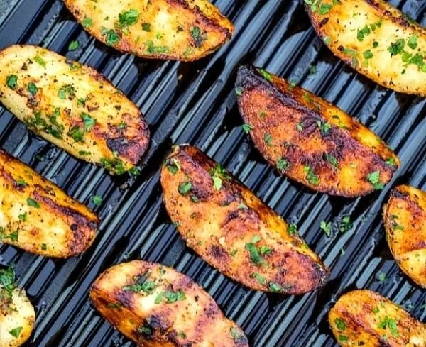 Delicious grilled potatoes served on a plate, perfect for BBQ and side dishes