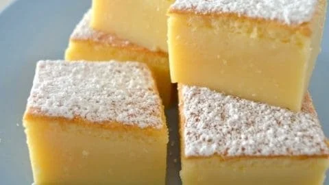 A slice of Magic Custard Cake showcasing its layers and creamy texture.