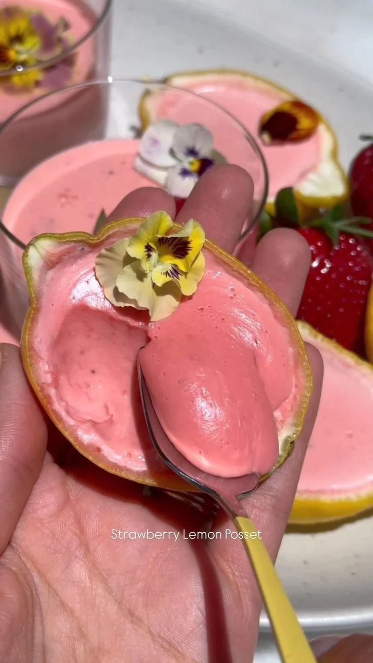 Delicious strawberry lemon posset dessert served in a glass.