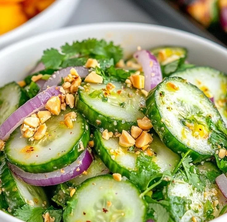 Freshly prepared Thai Cucumber Salad with vibrant vegetables and herbs