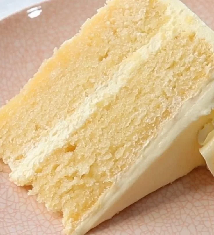 Delicious homemade vanilla cake with frosting and decorations