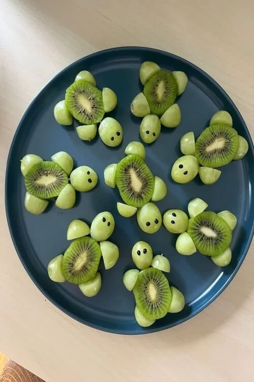 Colorful animal-themed birthday snack tray with fun treats and decorations