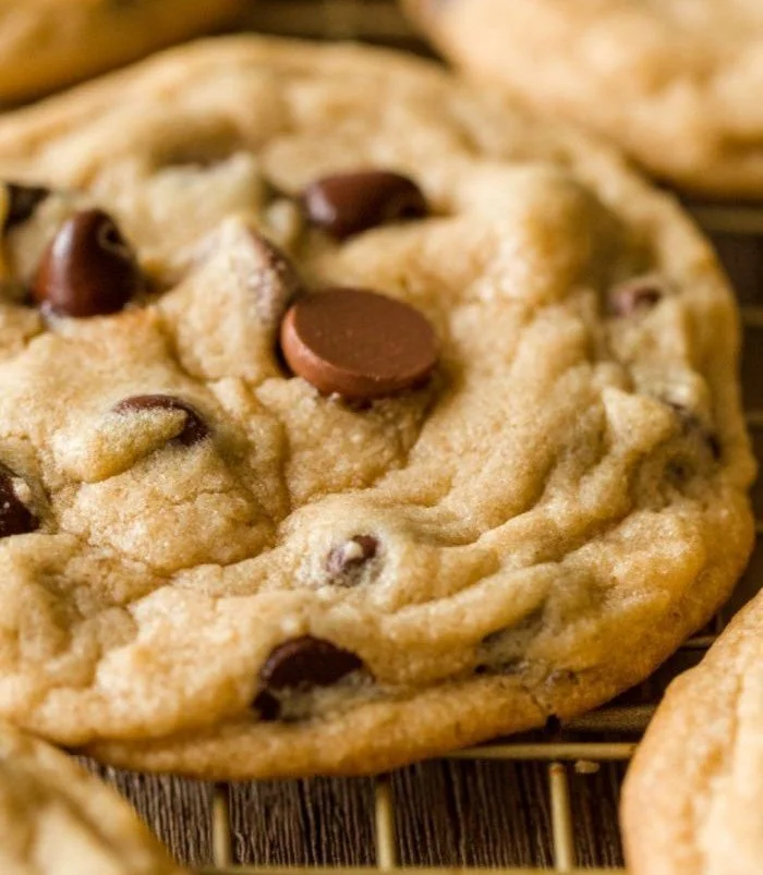 Baked classic chocolate chip cookies on a cooling rack