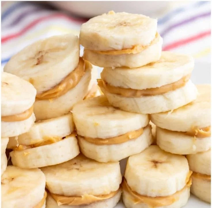 Delicious banana chocolate peanut butter bites on a rustic plate.
