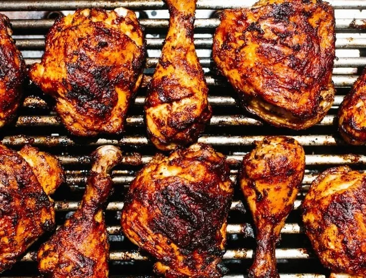 Juicy BBQ Chicken grilled to perfection with a smoky glaze and colorful sides.