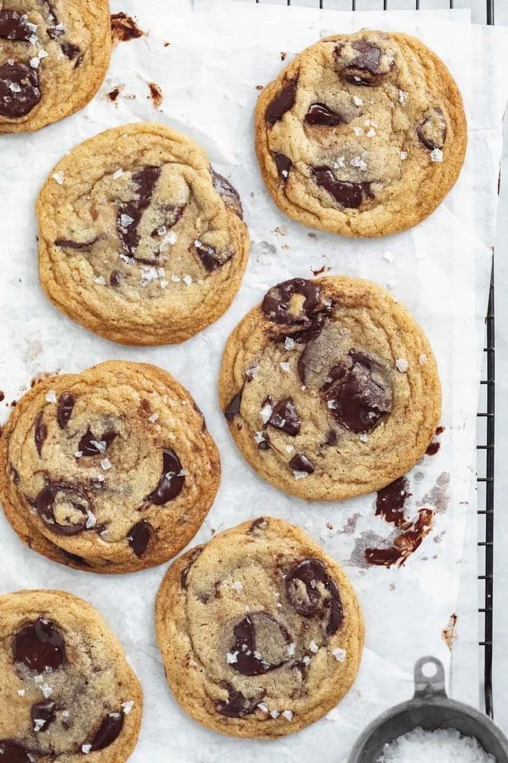 Freshly baked chewy chocolate chip cookies on a cooling rack