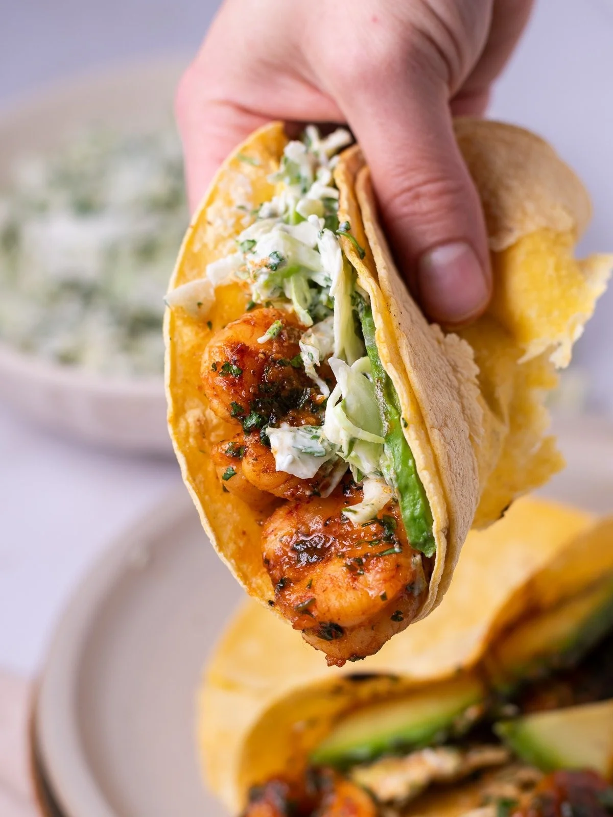 Cilantro lime shrimp tacos with slaw and fresh toppings