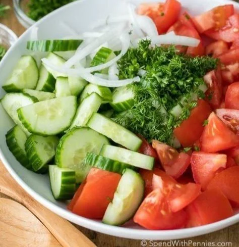 Creamy Cucumber and Tomato Salad in a bowl with fresh ingredients