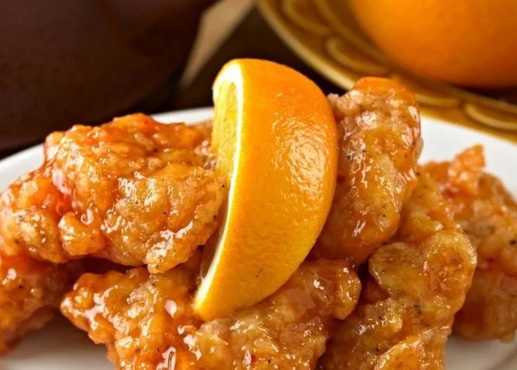 Crispy Air Fryer Orange Chicken served with garnishes