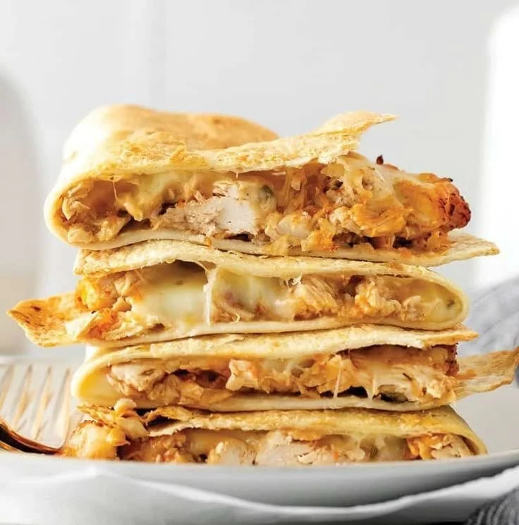 Delicious crispy air fryer quesadilla with melted cheese and toppings