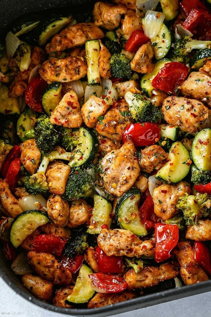 Crispy one-pan chicken with assorted vegetables on a platter