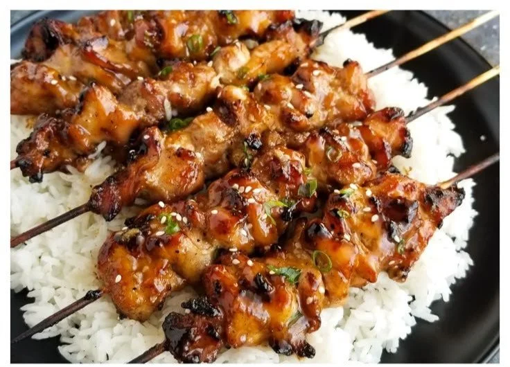 Delicious teriyaki chicken skewers with a glossy glaze served on a plate