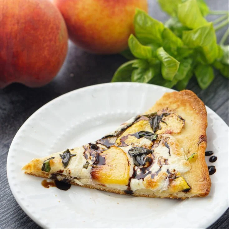Easy Peach Basil Naan Pizza topped with fresh peaches and basil