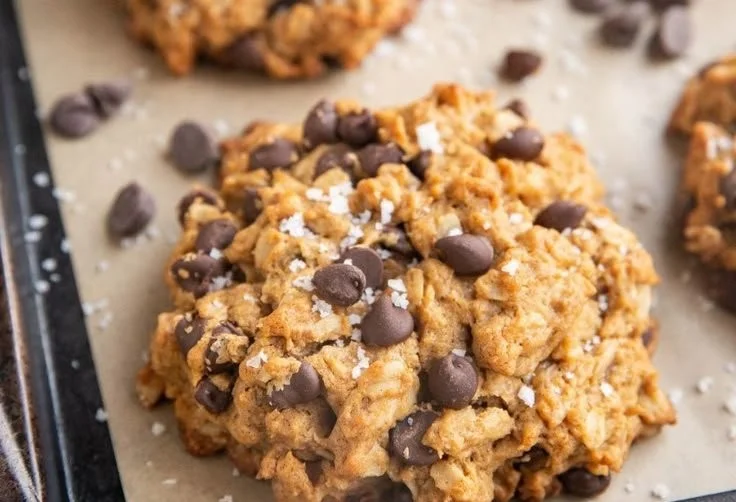 Tray of healthy peanut butter oatmeal cookies on a wooden table