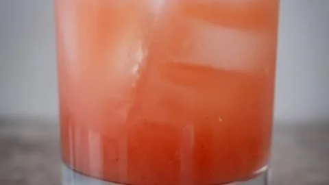 Glass of Iced White Guava Tea Lemonade with fresh lemon and guava slices