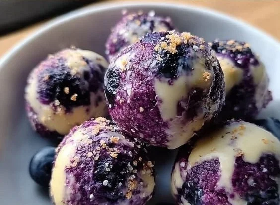 Mini Blueberry Cheesecake Bites served on a platter with fresh blueberries