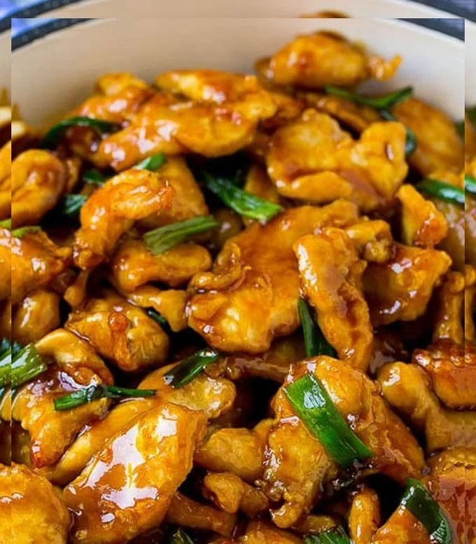 Mongolian chicken stir-fry with colorful vegetables and savory sauce in a skillet