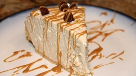 No-Bake Peanut Butter Pie topped with chocolate and peanuts