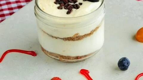 Protein-packed cheesecake jars ready to be enjoyed as a healthy dessert option.