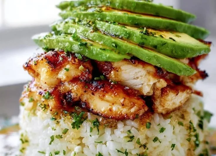 Delicious avocado honey lime chicken rice served on a plate
