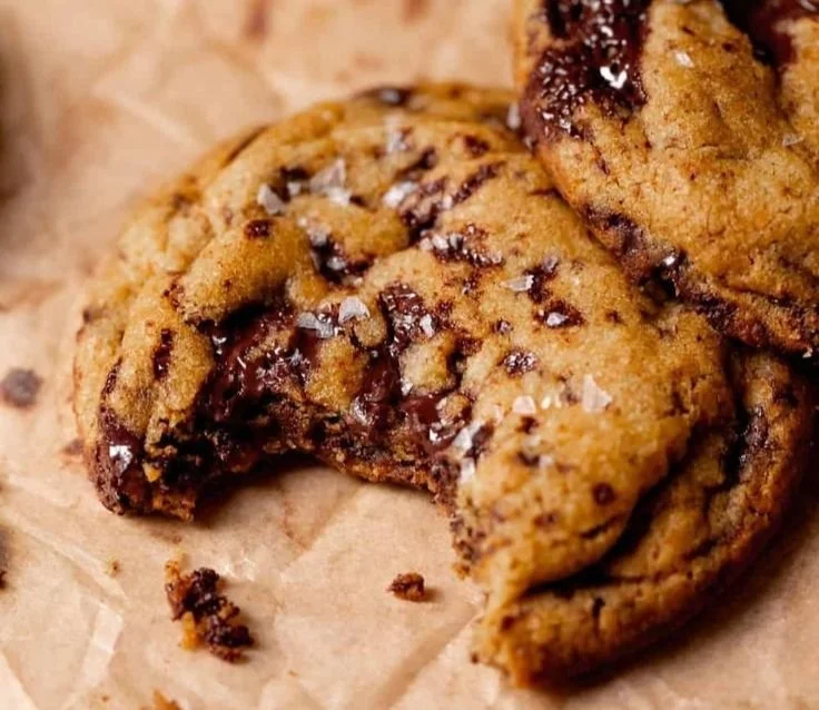 Chewy pumpkin chocolate chip cookies on a plate, ready to enjoy.