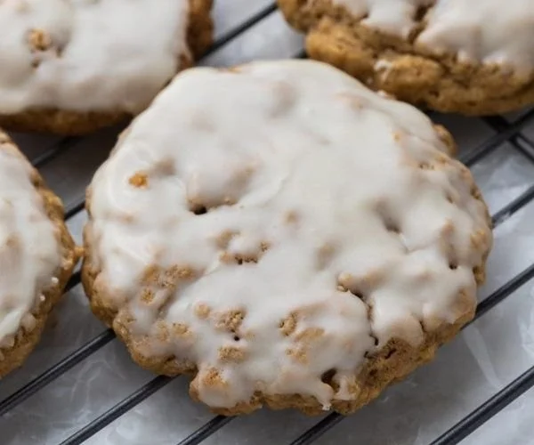Delicious copycat Crumbl iced oatmeal cookies on a plate