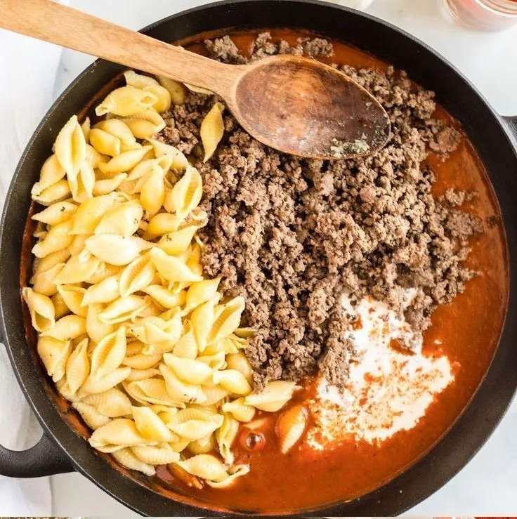 Creamy beef shells served with a savory sauce in a bowl