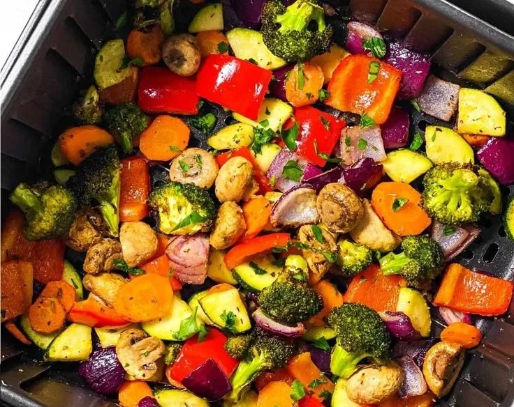 Crispy air fryer veggies served in a bowl, showcasing vibrant colors and textures.