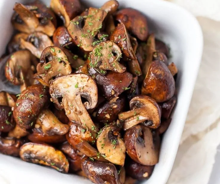 Crispy air-fried garlic mushrooms served on a plate