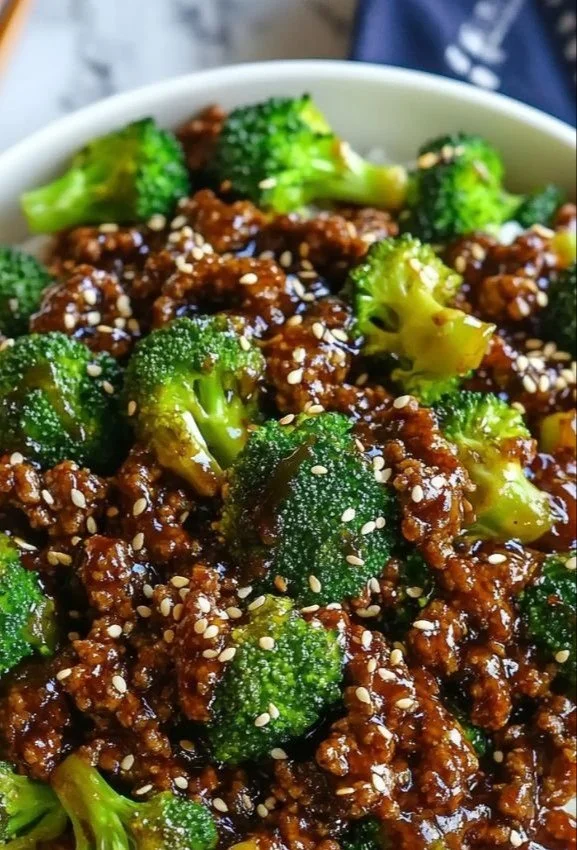 Plate of hamburger meat with broccoli cooked to perfection.