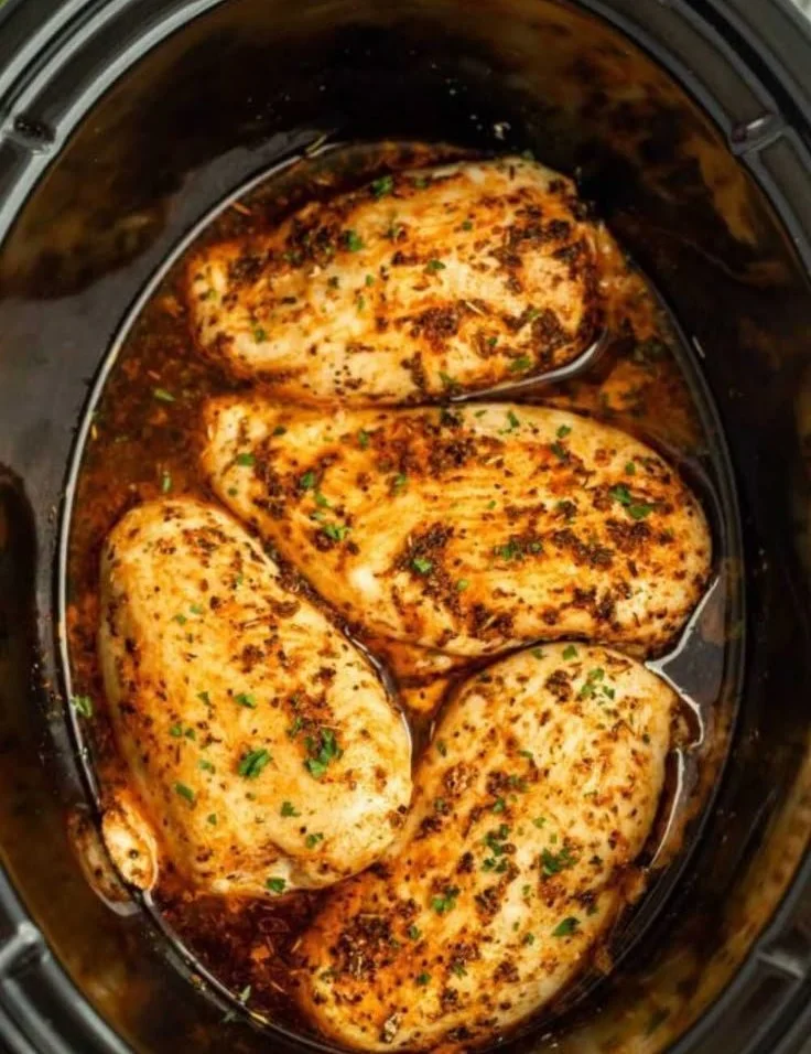 Delicious slow cooker chicken breasts served with vegetables