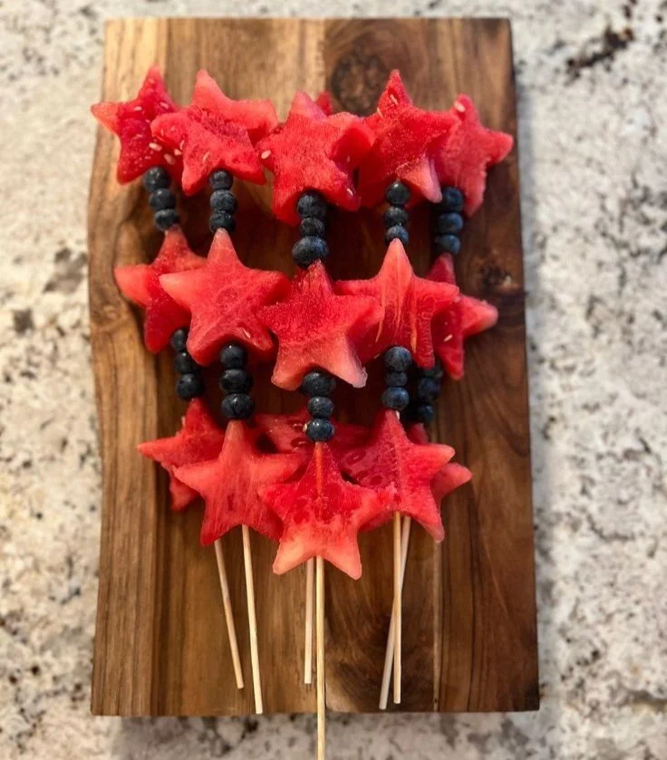 Stars and Stripes fruit skewers with strawberries, blueberries, and banana slices
