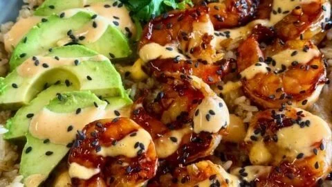 Delicious sticky shrimp teriyaki served over rice in a vibrant bowl