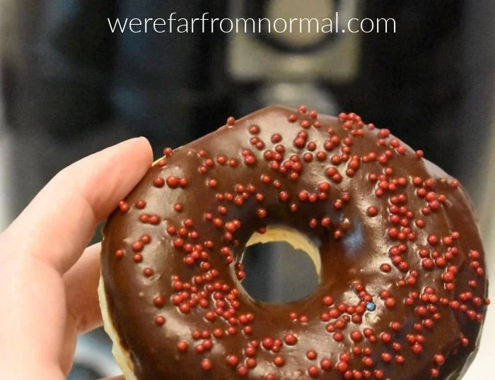 Homemade air fryer donuts on a plate, showcasing delicious treats made easy.