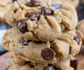 Soft peanut butter chocolate chip cookies on a baking tray, ready to enjoy.