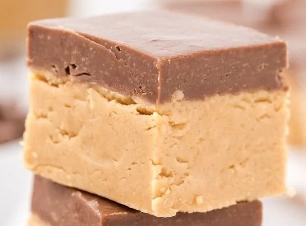 Homemade Buckeye Fudge squares on a decorative plate