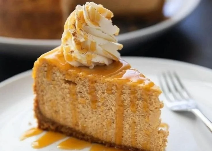 Creamy pumpkin cheesecake topped with cinnamon, a delicious fall dessert