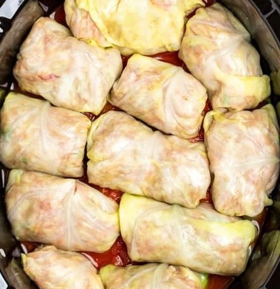 Crockpot beef sausage cabbage rolls served on a plate