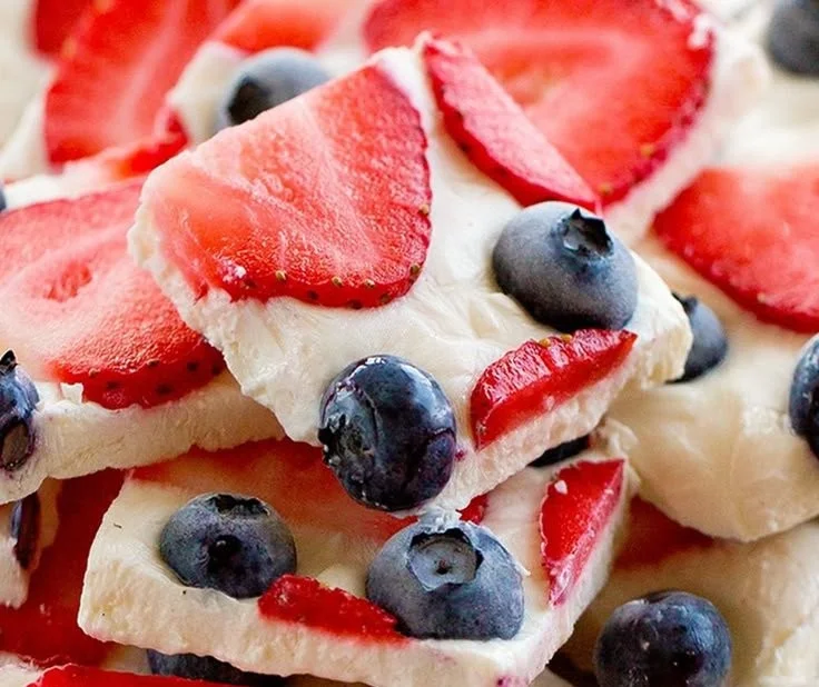 Plate of delicious easy healthy Greek yogurt bark topped with fruit and nuts