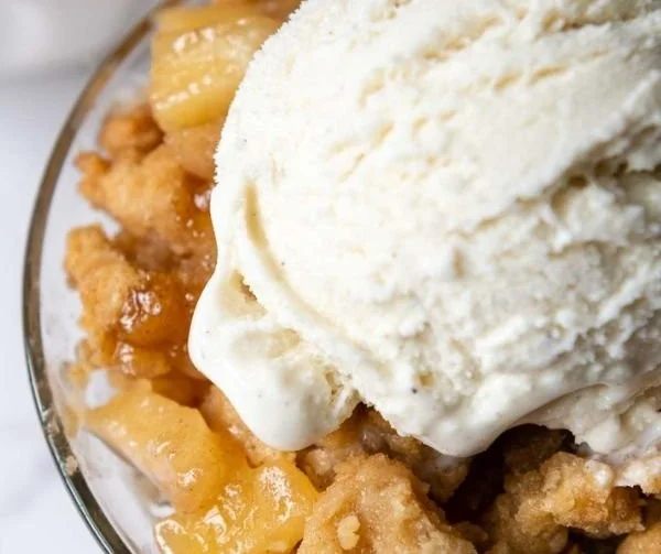 Gluten-free apple crisp with oat topping in a baking dish
