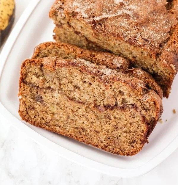 Gluten-Free Cinnamon Swirl Banana Bread with a sprinkle of cinnamon on top