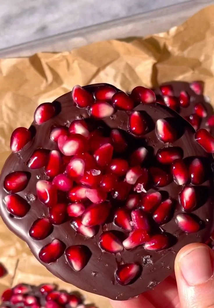 Gourmet pomegranate dark chocolate bites in a decorative box