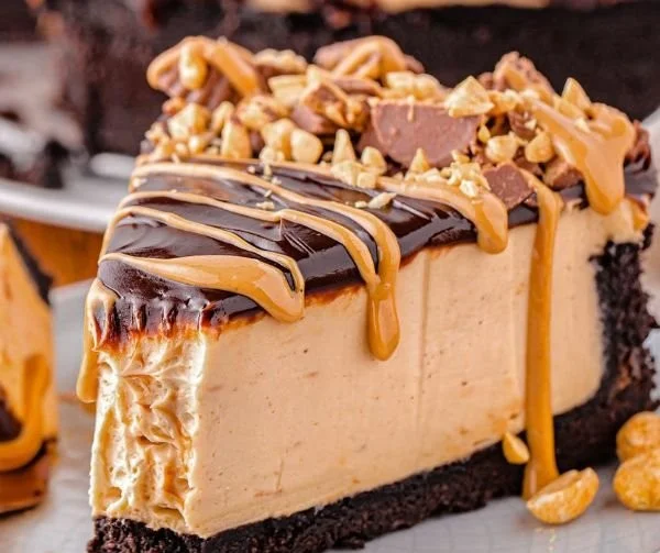 No Bake Peanut Butter Cheesecake topped with chocolate and peanut butter drizzle